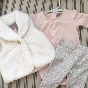 Baby outfit with fur vest, pants and body suite.
